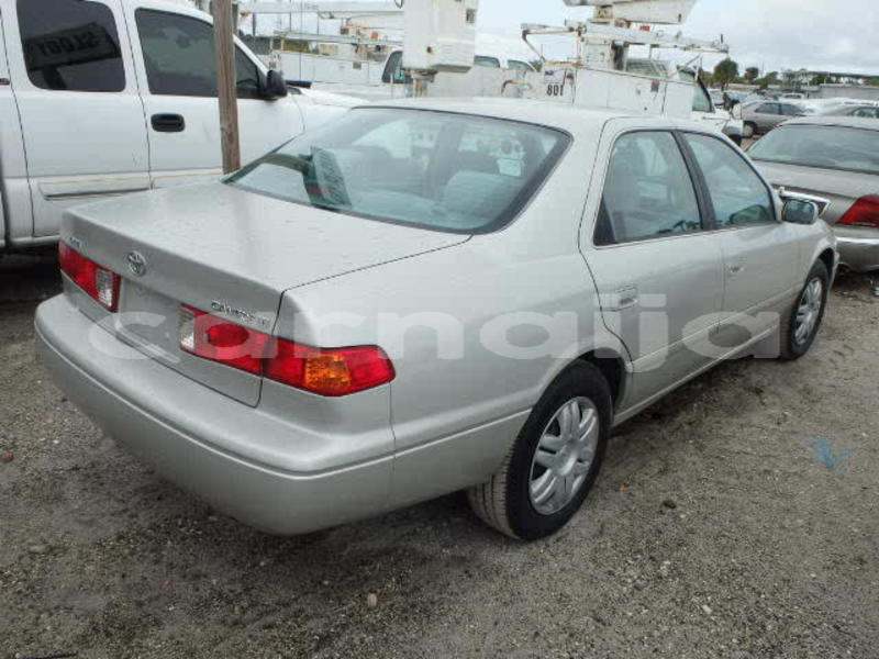 Big with watermark 2004 toyota camry tiny light back side view 2