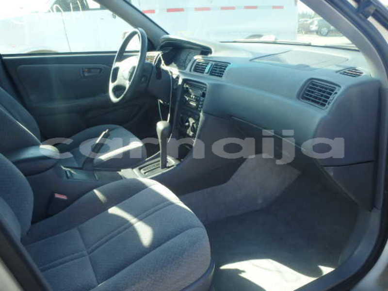 Big with watermark 2004 toyota camry tiny light side view