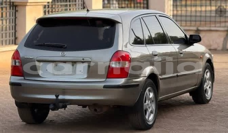 Big with watermark mazda 323 abia state aba 47749